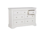  A lifestyle image featuring the Mabel Dressing Chest in Bone, displayed in a beautifully styled bedroom setting. The seven drawers provide ample space for your clothing collection, while the bone color adds a soft and inviting touch to the overall aesthetic of the room.