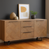 Wooden sideboard in a room with dark grey walls